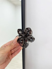PINZA FLOR CAREY NEGRA