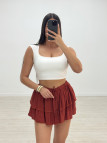 FALDA MINI VOLANTE (CON SHORT) - CALDERA